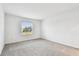 Well-lit bedroom with grey carpet and window at 5217 Patano Loop, Palmetto, FL 34221