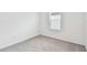 Well-lit bedroom with grey carpet and window with blinds at 5217 Patano Loop, Palmetto, FL 34221