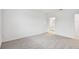 Bright bedroom featuring grey carpet and access to bathroom at 5217 Patano Loop, Palmetto, FL 34221