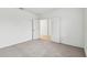 Bright bedroom with grey carpet and double door closet at 5217 Patano Loop, Palmetto, FL 34221