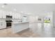 Modern kitchen with white shaker cabinets, stainless steel appliances, and an island at 5217 Patano Loop, Palmetto, FL 34221