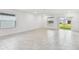 Spacious living room featuring tile flooring and access to backyard at 5217 Patano Loop, Palmetto, FL 34221