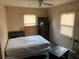 Simple bedroom with a double bed and dresser at 1073 Putnam Dr, Sarasota, FL 34234