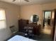 Bedroom with dresser and small chair at 1073 Putnam Dr, Sarasota, FL 34234