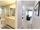 Bathroom featuring a large mirror, a bathtub with shower, and neutral color palette at 1206 Laurel Pines Cir, Nokomis, FL 34275