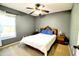 Bedroom featuring a ceiling fan, neutral color palette, and a window that provides natural light at 1206 Laurel Pines Cir, Nokomis, FL 34275