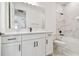 Modern bathroom with white cabinets, marble shower, and bathtub at 18053 Cherished Loop, Bradenton, FL 34211