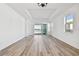 Bright living room with hardwood floors and sliding glass doors to patio at 18053 Cherished Loop, Bradenton, FL 34211