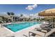 Relaxing resort-style pool with lounge chairs and umbrellas at 18053 Cherished Loop, Bradenton, FL 34211