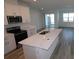 Modern kitchen featuring stainless steel appliances and quartz countertops at 310 Via Anina Dr, Sarasota, FL 34243