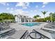 Resort-style pool with a large covered patio and plenty of lounge chairs at 310 Via Anina Dr, Sarasota, FL 34243