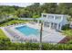 Aerial view of community pool, cabana, and lounge chairs at 310 Via Anina Dr, Sarasota, FL 34243