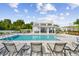 Relaxing community pool with lounge chairs and cabana at 310 Via Anina Dr, Sarasota, FL 34243