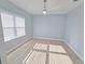 Spacious bedroom with wood-look tile floors and ceiling fan at 3426 79Th Street W Cir # 7-203, Bradenton, FL 34209