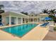 Resort-style pool with lounge chairs and cabana at 3426 79Th Street W Cir # 7-203, Bradenton, FL 34209