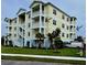 Three-story building with balconies and a spiral staircase, located near a street and landscaping at 3426 79Th Street W Cir # 7-203, Bradenton, FL 34209