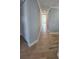 Light hallway with tile floors and neutral-toned walls at 3426 79Th Street W Cir # 7-203, Bradenton, FL 34209