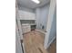 Bright laundry room, featuring white cabinets and wood-look tile floors at 3426 79Th Street W Cir # 7-203, Bradenton, FL 34209