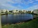 Community with multiple buildings surrounding a pond at 3426 79Th Street W Cir # 7-203, Bradenton, FL 34209