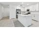 Modern kitchen with white cabinets and a large island at 5406 Tripoli Dr, Palmetto, FL 34221