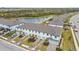 Aerial view of townhouses and a pond at 5410 Tripoli Dr, Palmetto, FL 34221