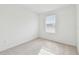 Well-lit bedroom featuring carpet flooring and window blinds at 5410 Tripoli Dr, Palmetto, FL 34221