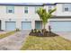 Townhouse exterior with light blue garage doors at 5410 Tripoli Dr, Palmetto, FL 34221