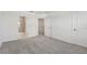 Spacious bedroom with grey carpet, double door closet and bathroom access at 5414 Tripoli Dr, Palmetto, FL 34221