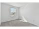 Well-lit bedroom featuring grey carpet and a window with blinds at 5414 Tripoli Dr, Palmetto, FL 34221