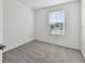 Light and airy bedroom with grey carpet and window with blinds at 5414 Tripoli Dr, Palmetto, FL 34221