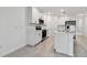 Modern white kitchen with stainless steel appliances and island at 5414 Tripoli Dr, Palmetto, FL 34221