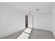 Well-lit bedroom featuring a closet and carpet floor at 5426 Tripoli Dr, Palmetto, FL 34221