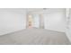 Bright bedroom featuring neutral walls and gray carpeting at 5426 Tripoli Dr, Palmetto, FL 34221