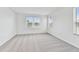 Bright bedroom with grey carpet and large window at 5429 Tripoli Dr, Palmetto, FL 34221