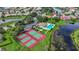 Community aerial view with tennis courts and pool at 750 Pond Lily Way, Venice, FL 34293