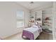 Bedroom with built-in shelves and twin bed at 750 Pond Lily Way, Venice, FL 34293