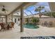 Enclosed pool and patio with seating area at 750 Pond Lily Way, Venice, FL 34293