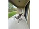 Covered patio with view of backyard and conservation area at 11854 Thicket Wood Dr, Riverview, FL 33579