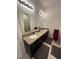 Double sink bathroom with granite countertop and large mirror at 11854 Thicket Wood Dr, Riverview, FL 33579