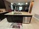 Kitchen island with double sink and built-in dishwasher at 11854 Thicket Wood Dr, Riverview, FL 33579