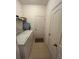 Laundry room with washer, dryer, and extra storage at 11854 Thicket Wood Dr, Riverview, FL 33579