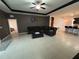 Spacious living room with tile floors and a large sectional sofa at 11854 Thicket Wood Dr, Riverview, FL 33579