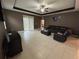 Open living room featuring tile floors and access to backyard at 11854 Thicket Wood Dr, Riverview, FL 33579