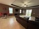 Living room with leather furniture and sliding glass doors at 11854 Thicket Wood Dr, Riverview, FL 33579