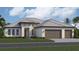 Two-story home with a two-car garage and landscaped lawn at 13301 Amargo Ct, Venice, FL 34293