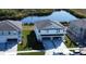 Aerial view of townhome community near a pond at 13719 Emerald Fields Dr, Hudson, FL 34667