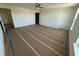 Large bedroom with hardwood floors and a walk-in closet at 13725 Emerald Fields Dr, Hudson, FL 34667