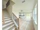 Modern staircase leading to upper level with open floor plan at 13992 Emerald Fields Dr, Hudson, FL 34667