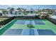 Two pickleball courts with a picnic table in the center at 17130 Savory Mist Cir, Lakewood Ranch, FL 34211