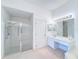 Bathroom with shower, vanity, and walk-in shower at 1718 S Pebble Beach Blvd, Sun City Center, FL 33573